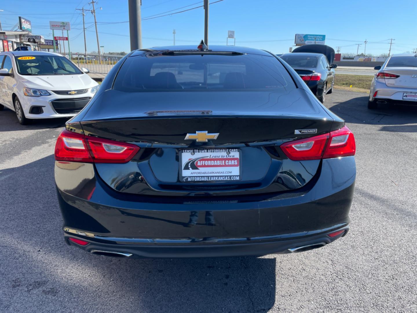 2017 Black Chevrolet Malibu (1G1ZH5SX0HF) with an 4-Cyl, Turbo, 2.0 Liter engine, Automatic, 9-Spd transmission, located at 8008 Warden Rd, Sherwood, AR, 72120, (501) 801-6100, 34.830078, -92.186684 - Photo#6